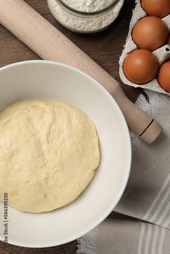 Cooking scones with soda water. Dough and ingredients on wooden table, flat lay