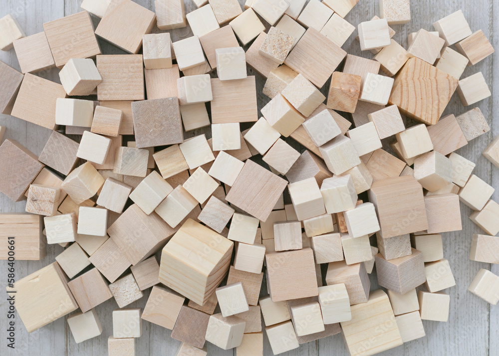Abstract background. Cubes, different sizes on white table. Abstract background. Cubes, different sizes on white table.