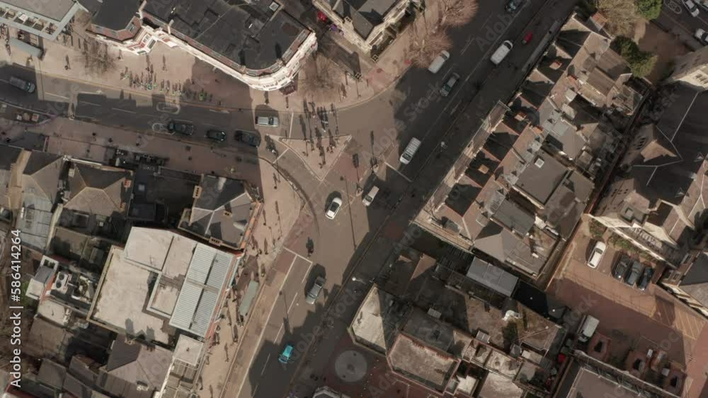Stationary top down aerial shot over low speed traffic intersection UK Stationary top down aerial shot over low speed traffic intersection UK