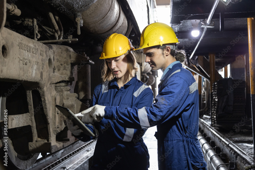 Engineer train Inspect the train's diesel engine, railway track in depot of train
Engineer train Inspect the train's diesel engine, railway track in depot of train