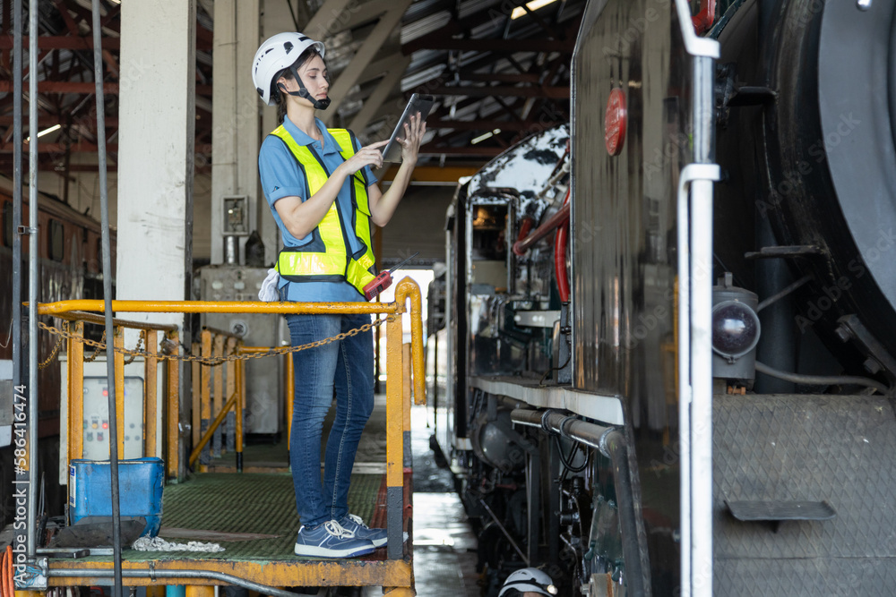 Engineer train Inspect the train's diesel engine, railway track in depot of train