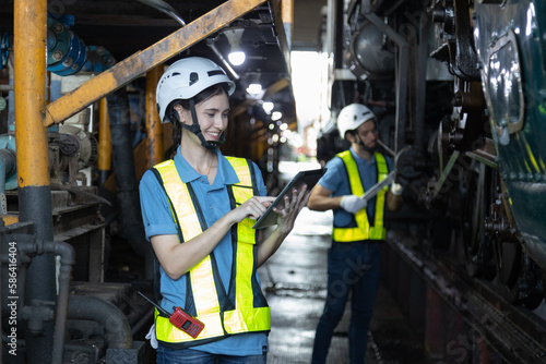 Engineer train Inspect the train's diesel engine, railway track in depot of train 