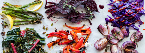 Narrow view of messy groups of steamed, sauteed and roasted vegetables.
