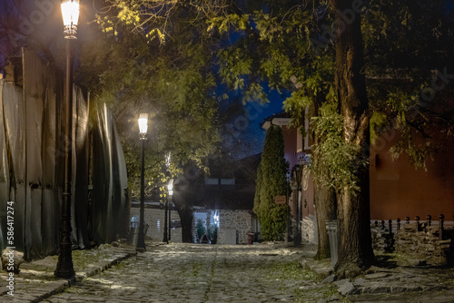 Obraz na płótnie Dark and mysterious alley illuminated at night in Plovdiv, Bulgaria w salonie