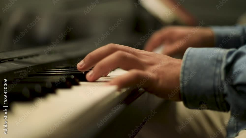 A man playing the piano - close up
- slow motion - eye level A man playing the piano - close up
- slow motion - eye level