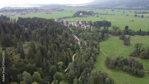 Aerial reveal view of Lake Lucerne Neuschwanstein Castle and the Swiss Alps