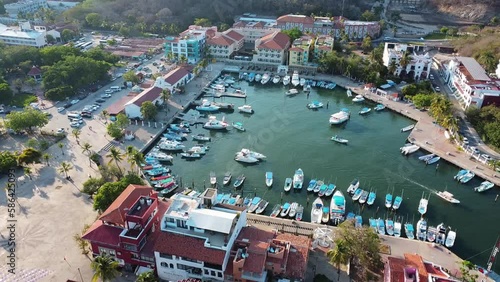 drone footage panoramic view of huatulco oaxaca mexico summer travel destination tropical beach sea boats port pier 