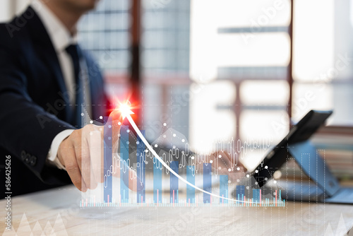 Businessman planning and strateg touching digital data growth graph and progress of business and analyzing financial and investment information. photo