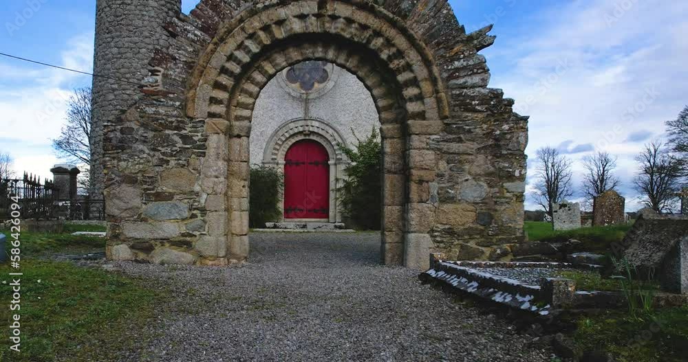4 K Drone flight through the stone arch entrance to Castledermot church and round tower Co Kildare Ireland dating to 800 AD 4 K Drone flight through the stone arch entrance to Castledermot church and round tower Co Kildare Ireland dating to 800 AD