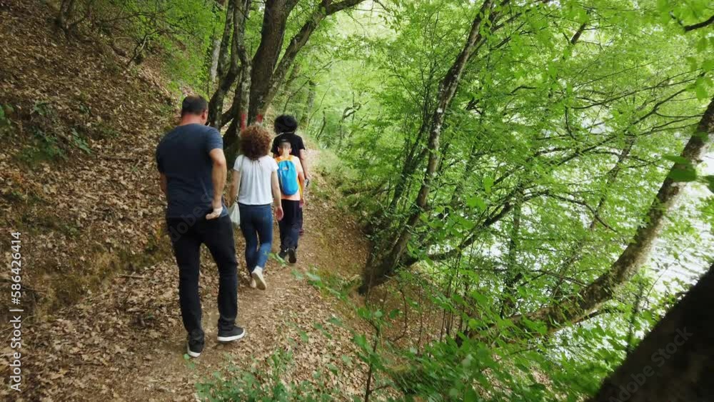 Slow Motion of Extended Family Group On Hike Through Woods In Fall. Adventure family concept Slow Motion of Extended Family Group On Hike Through Woods In Fall. Adventure family concept