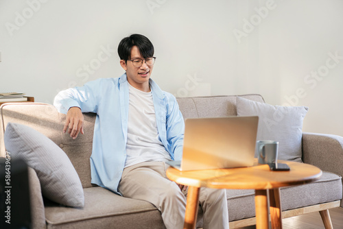 Businessman in casual is sitting to resting on comfortable sofa