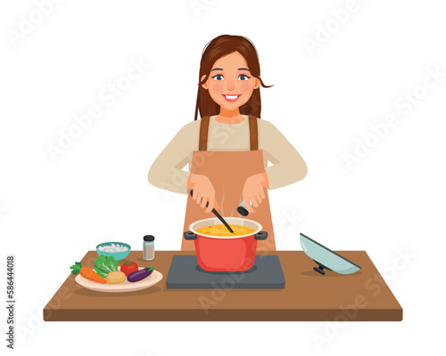 Young woman cooking delicious vegetable soup with pan adding spices in the kitchen