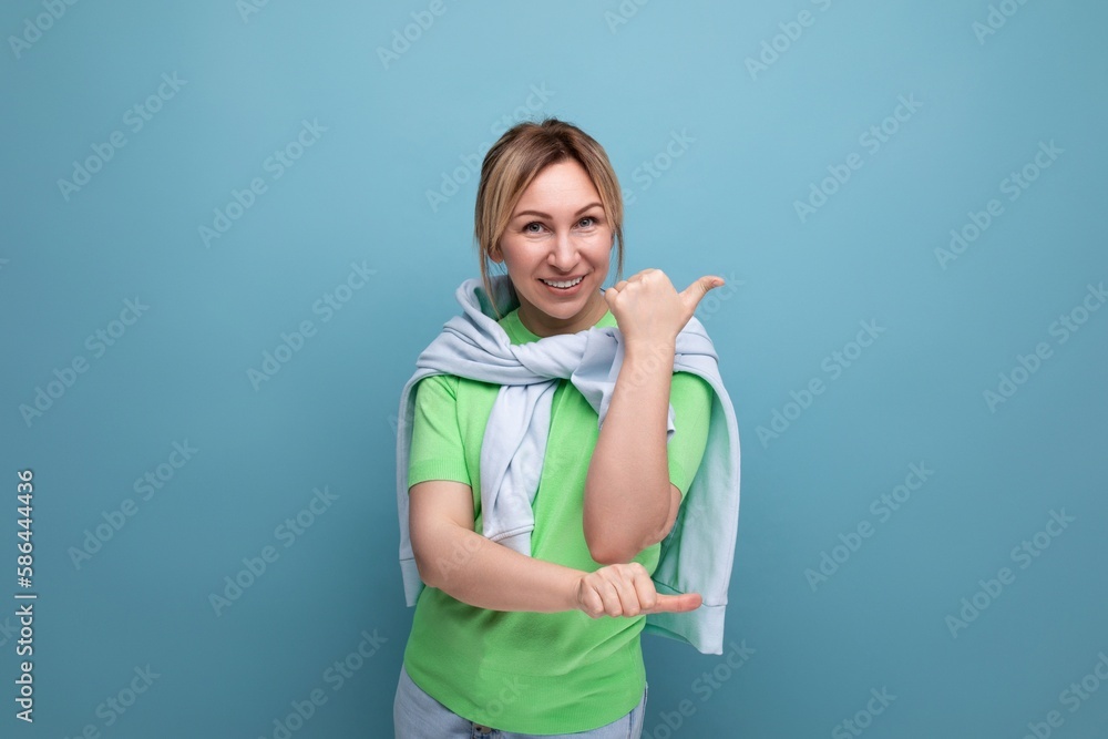 banner portrait of a positive bright girl in a casual outfit on a blue background with copy space banner portrait of a positive bright girl in a casual outfit on a blue background with copy space