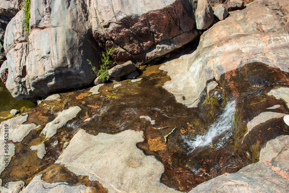 A spring flows from the Gneiss Rocks and formaations in the Texas Hill Country