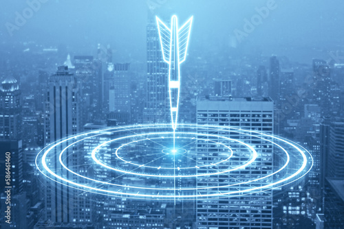 Digital bullseye aim with arrow hologram on blurry city backdrop. Aiming  success and targeting concept. Double exposure.