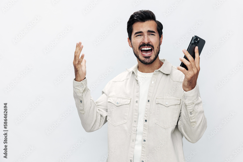 Close-up portrait man talking on the phone anger dissatisfaction and annoyance on a white isolated background, fashionable clothing style, copy space, space for text Close-up portrait man talking on the phone anger dissatisfaction and annoyance on a white isolated background, fashionable clothing style, copy space, space for text