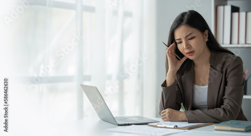 copy space , panorama , banner ,tired business woman sleepy and bored from sitting at a desk for a long time and has office syndrome