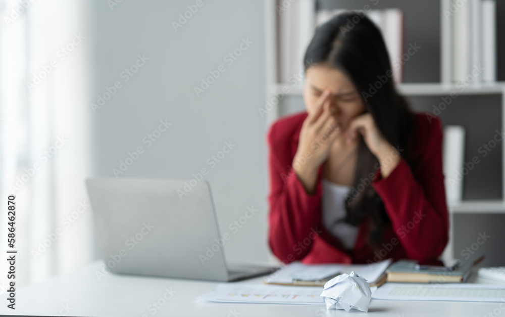 tired business woman sleepy and bored from sitting at a desk for a long time and has office syndrome tired business woman sleepy and bored from sitting at a desk for a long time and has office syndrome