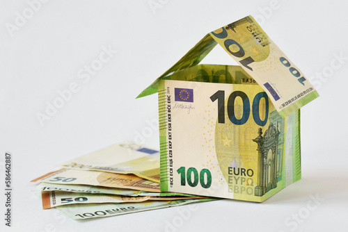 Bild auf Leinwand House made of euro banknotes on white background - Concept of building bonus, re
