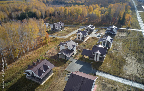 Aerial photo of scientific cottage village Sigma. Beautiful autumn country landscape from above. Novosibirsk, Siberia, Russia photo