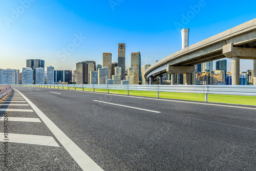 Asphalt highway and city skyline with modern buildings in Beijing  China.