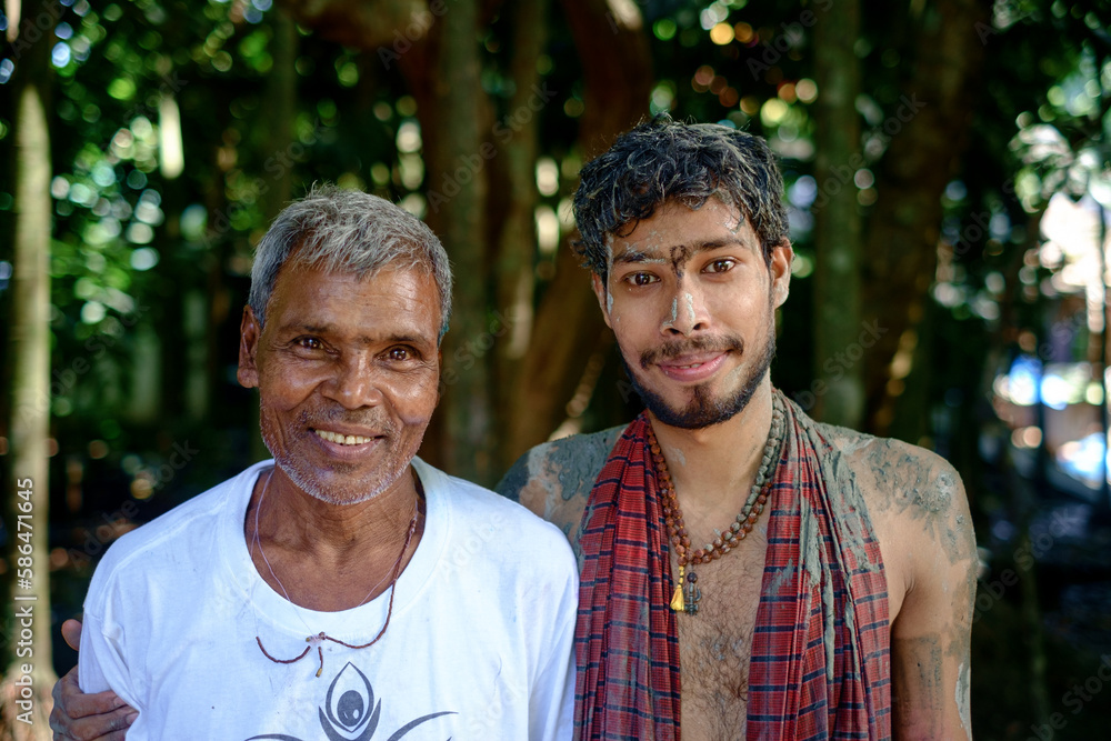 Portrait of south asian senior citizen with a young man,happiness among generations, durga puja art in t shirt Portrait of south asian senior citizen with a young man,happiness among generations, durga puja art in t shirt