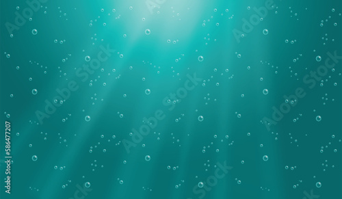 Underwater background with water bubbles and undersea light rays shine