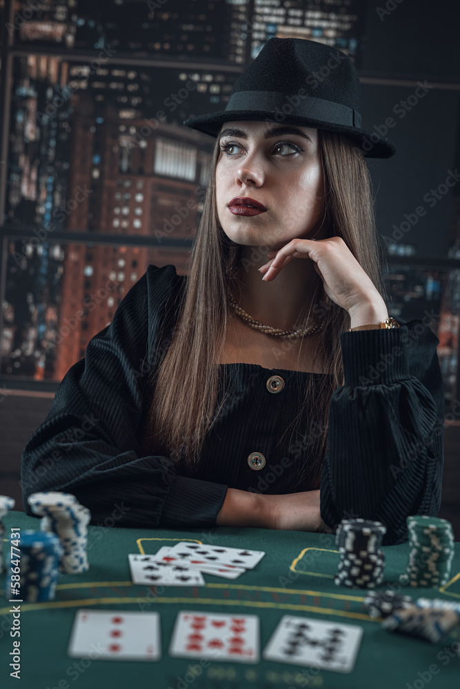 Portrait of elegant stylish young woman with card and casino chips play poker game Portrait of elegant stylish young woman with card and casino chips play poker game