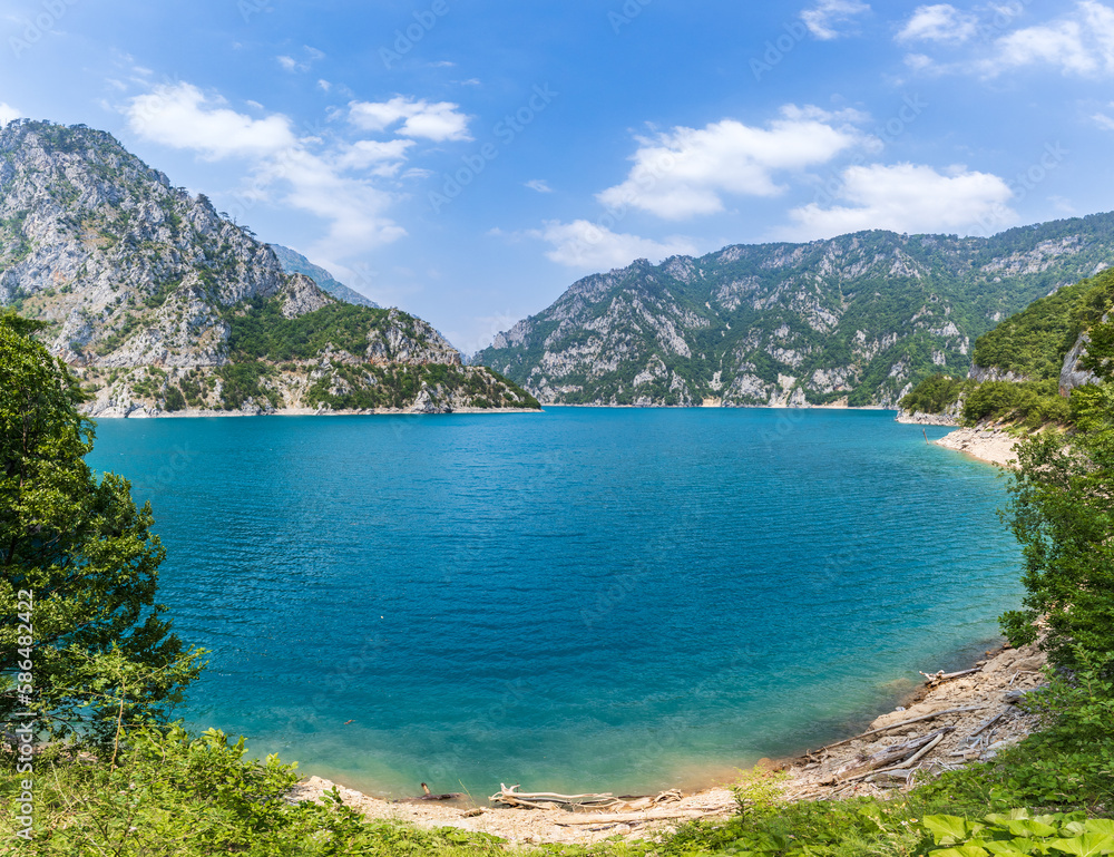 Wide angle view of Piva lake or Pivske Jezero in Montenegro at summer noon