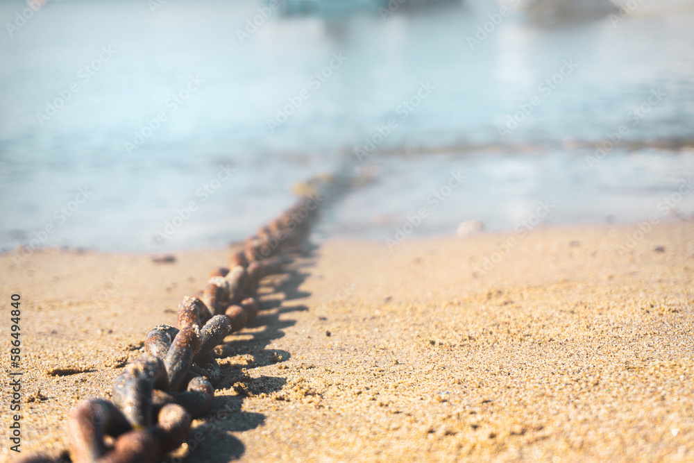 Chain of an anchored boat. Selective focus on chain. Chain of an anchored boat. Selective focus on chain.