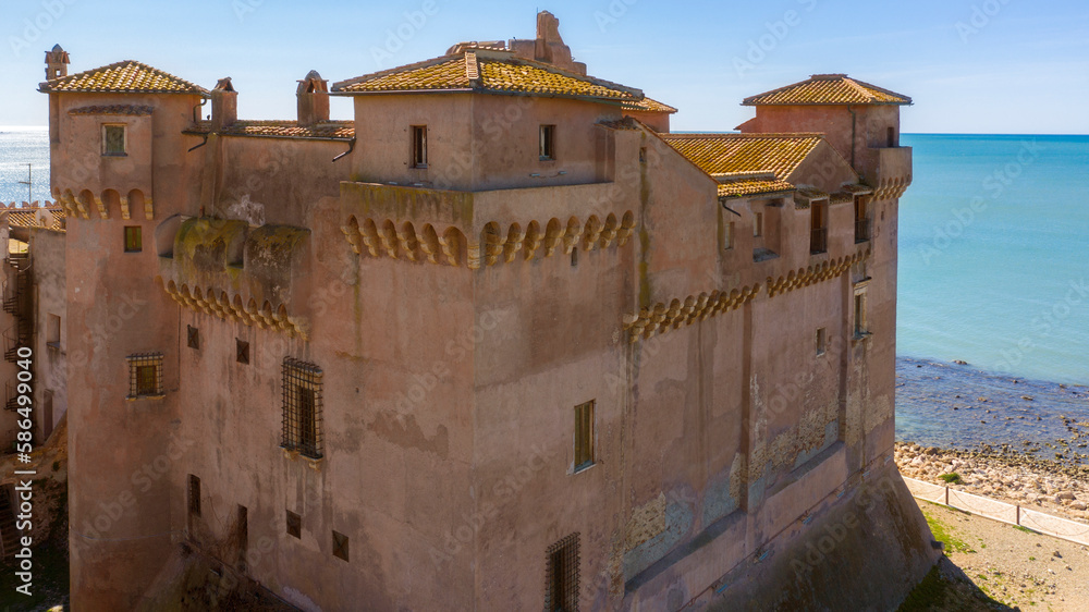 Aerial view of the Castle of Santa Severa, located in Santa Marinella in Lazio, in the Metropolitan City of Rome, Italy. It is a medieval castle built on the beach and overlooking the Tyrrhenian Sea.