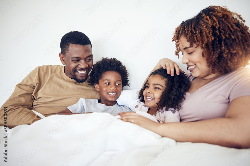 Family, father and mother with children on bed relaxing together for fun morning or holiday break at home. Happy dad, mom and kids relax and lying in bedroom enjoying comfort and bonding time Family, father and mother with children on bed relaxing together for fun morning or holiday break at home. Happy dad, mom and kids relax and lying in bedroom enjoying comfort and bonding time