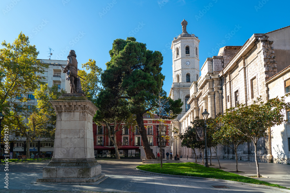 Valladolid, Spain - November 12 2022: Plaza de la Universidad Square, in the center of Valladolid. In background is the cathedral of Valladolid. Beautiful park for recreation near cathedral.