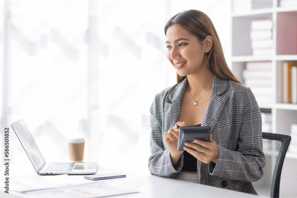 Young asian business woman manager accounting analyst checking bills, analyzing sales statistics management, taxes financial data documents or marketing report papers working in office using laptop.
Y Young asian business woman manager accounting analyst checking bills, analyzing sales statistics management, taxes financial data documents or marketing report papers working in office using laptop.
Y