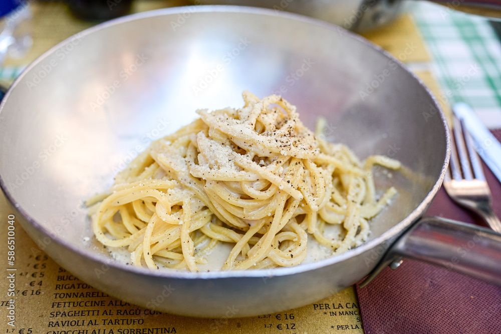 Fresh pasta spaghetti cacio e pepe at typical italian resaturant at Trastevere neighbourhood at Rome Fresh pasta spaghetti cacio e pepe at typical italian resaturant at Trastevere neighbourhood at Rome