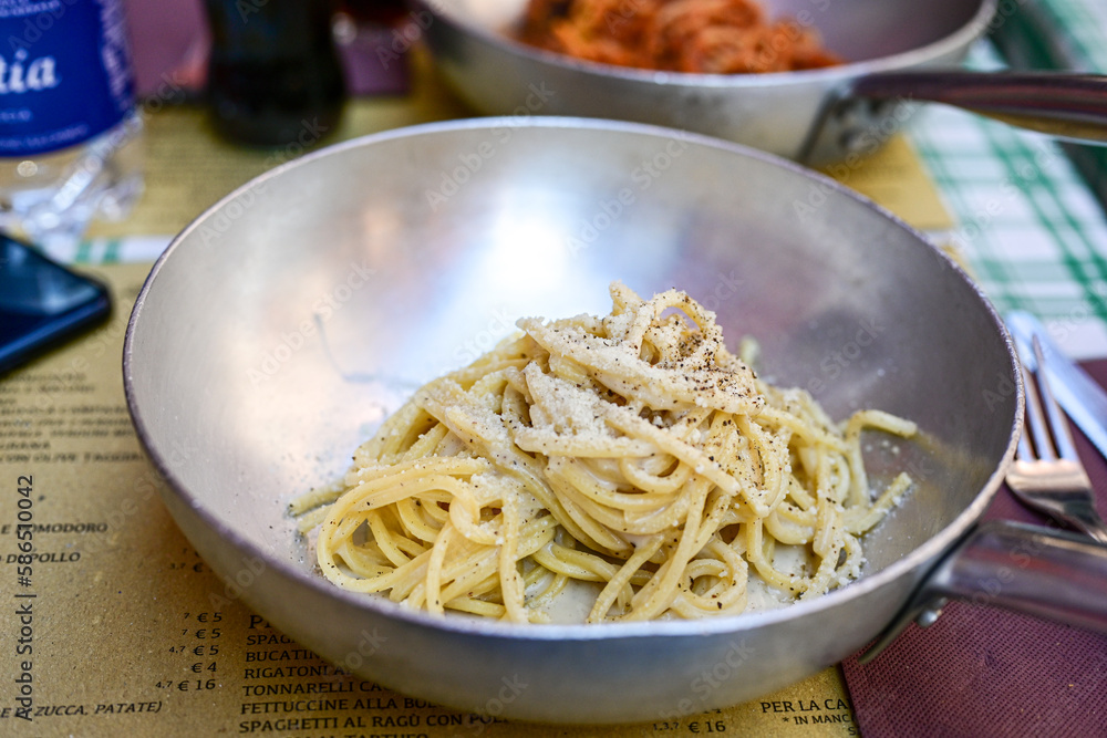 Fresh pasta spaghetti cacio e pepe at typical italian resaturant at Trastevere neighbourhood at