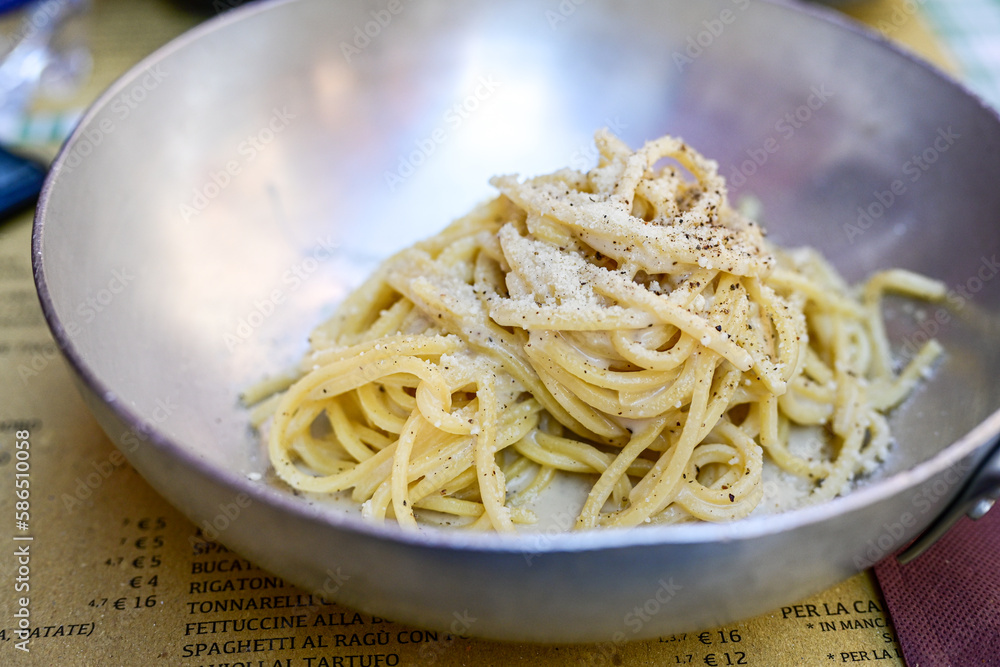 Fresh pasta spaghetti cacio e pepe at typical italian resaturant at Trastevere neighbourhood at