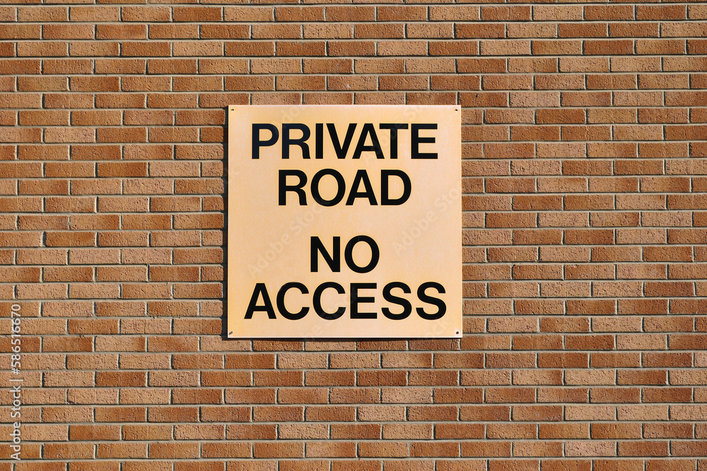 'Private Road No Access' Sign on Brick Wall 'Private Road No Access' Sign on Brick Wall