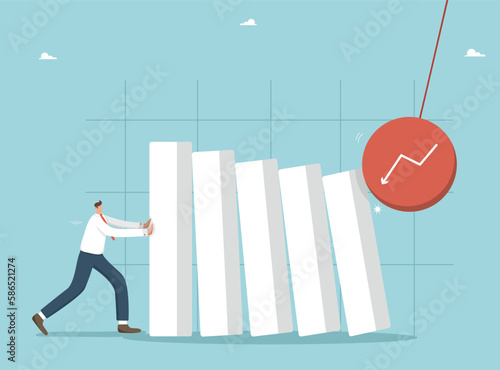 Holding back inflation and unemployment, maintaining his financial position, overcoming the economic crisis, the impact of the external market on business, a man holds the falling bars of the graph.