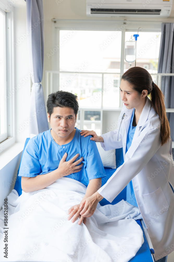 The old man on the nursing bed, the doctor talks, encourages, takes care of the elderly patient lying on the bed. The old man on the nursing bed, the doctor talks, encourages, takes care of the elderly patient lying on the bed.
