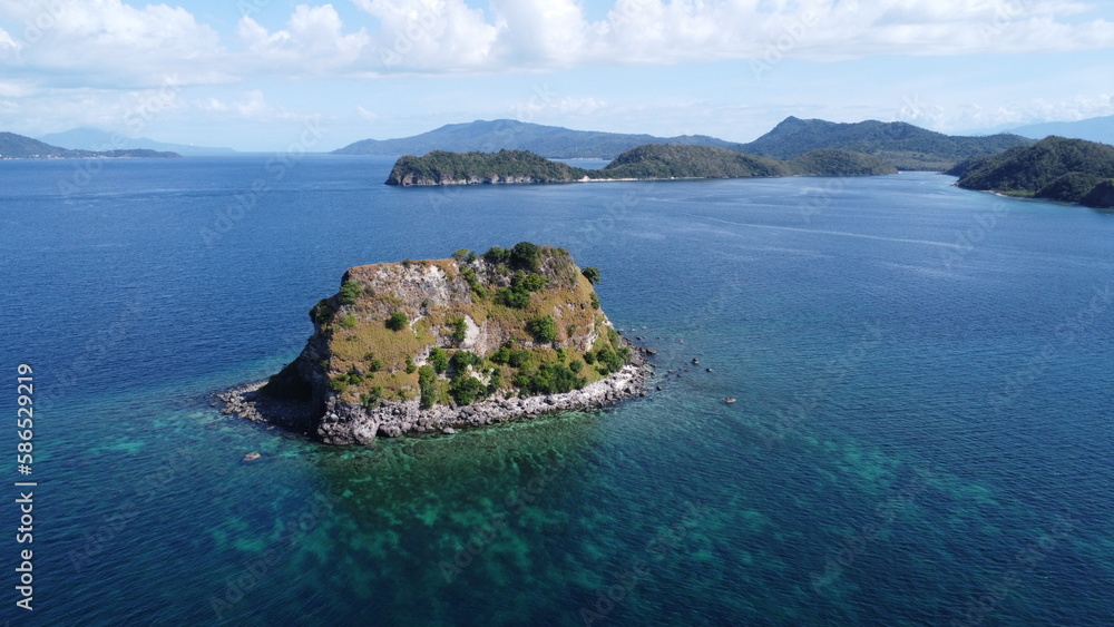 Sombrero Island. Anilao. Philippines. Small tropical island in the middle of the sea. Aerial view of an island in the ocean.