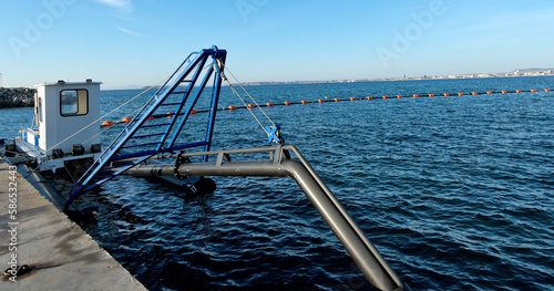 Floating dredge for deepening the bottom. At the seaport.