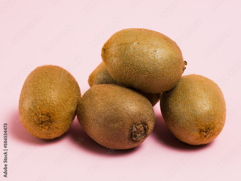 Kiwi without packaging on a pink background. Concept of earth day, zero waste and recycling. Kiwi without packaging on a pink background. Concept of earth day, zero waste and recycling.
