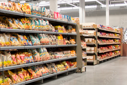 Tablou pe pânză Snacks and Chips on shelf at supermarket, suitable for mockup and new graphic design packagings solutions