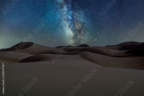 Starry sky and Milky Way over the desert at night.