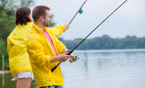 couple fishing on the river bank