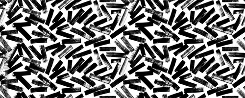 Brush strokes seamless pattern. Abstract background with diagonal brush strokes in different directions. Hand painted grunge texture. Retro monochrome vector ornament with bold lines.