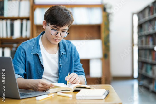 Student studying at library.