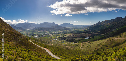 Franschhoek landscape beneath a partly cloudy sky