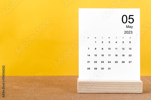 The May 2023 Monthly calendar for 2023 year on yellow table.